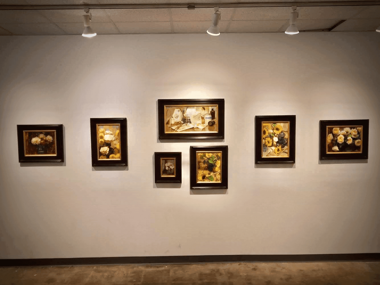 Gallery wall hung with seven of Zac's classical oil paintings